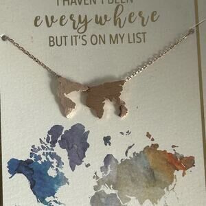 Francesca’s Rose Gold Tone World Map Necklace